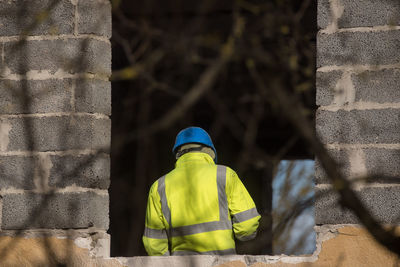 Rear view of man standing in building