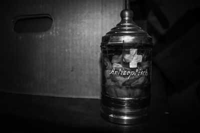 Close-up of glass jar on table