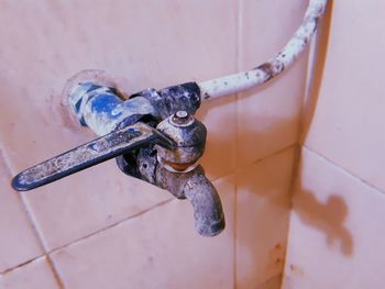 High angle view of old faucet in bathroom