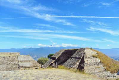 Old ruins of building against cloudy sky