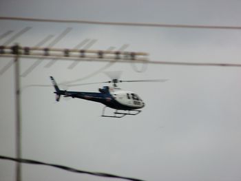 Low angle view of airplane flying against clear sky