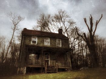 Low angle view of abandoned building against sky