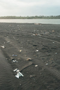 High angle view of sea shore against sky