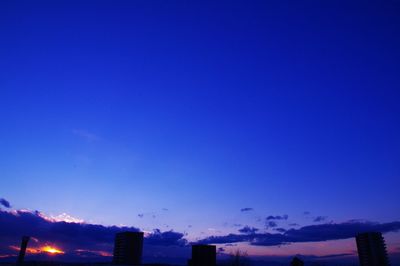 Low angle view of building against sky at sunset
