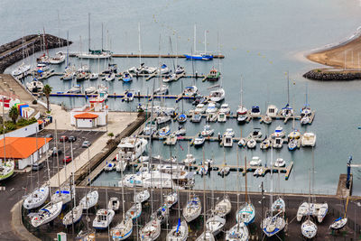 High angle view of boats moored at harbor