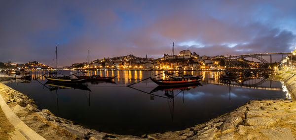 Boats moored at harbor