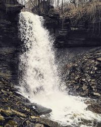 Water flowing through rocks in forest