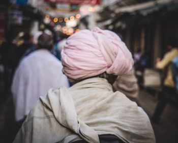 Rear view of people on street