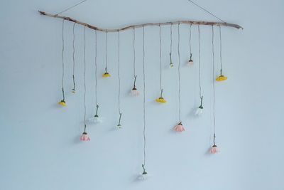 Close-up of clothes hanging against sky