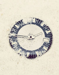 Close-up of clock on beach