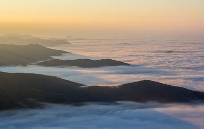 Scenic view of mountains against sky during sunset