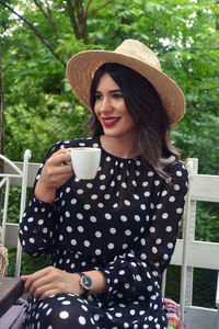 Young woman drinking coffee