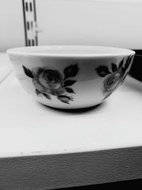 Close-up of cup on table