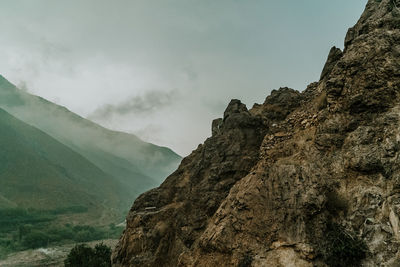 Low angle view of rock formations against sky