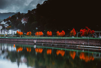 Scenic view of lake by building against sky