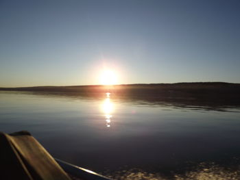 Scenic view of sea against clear sky during sunset