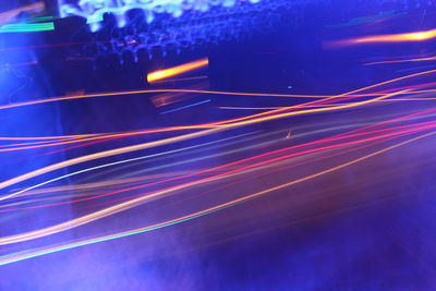 High angle view of light trails on road at night