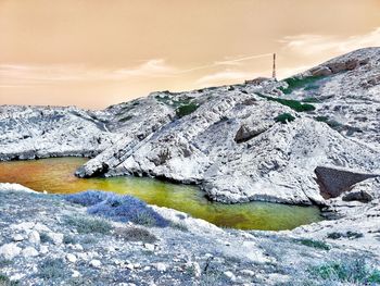 Scenic view of sea against sky during winter