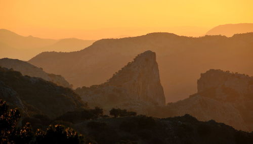 Scenic view of mountains against sky during sunset