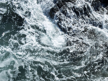 Full frame shot of rocks in sea