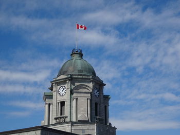 Low angle view of clock tower against sky