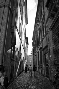 Alley amidst buildings in city