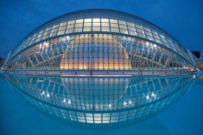 Reflection of illuminated building in water