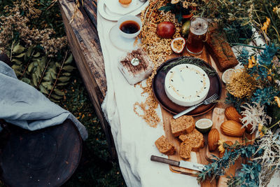 High angle view of food and drink with flowers on table