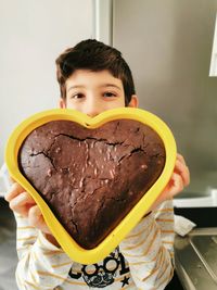 Portrait of boy holding ice cream