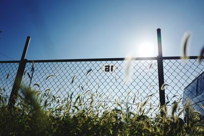 Chainlink fence against blue sky