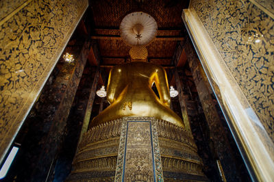 Low angle view of buddha statue in building