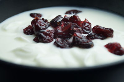 Close-up of dates on yogurt