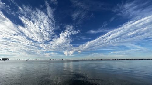 Scenic view of sea against blue sky