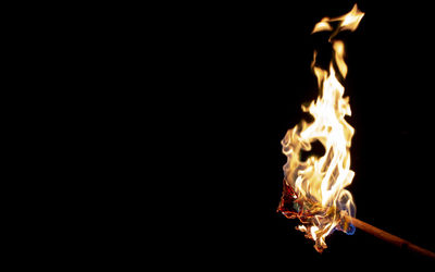 Close-up of fire against black background