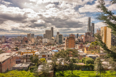 Buildings in city against sky