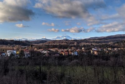 Scenic view of townscape against sky