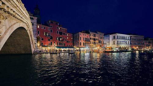 Illuminated buildings in city at night