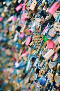 Close-up of padlocks hanging on railing