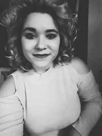 Close-up portrait of smiling young woman