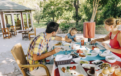 Family sitting on table