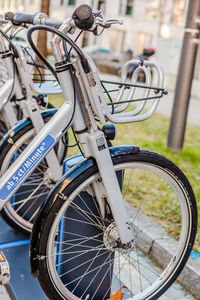 Close-up of bicycle parked in row