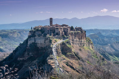 Panoramic view of castle on mountain against sky