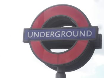 Close-up of road sign against white background