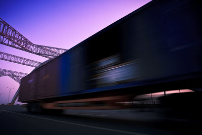 Train at railroad station against sky