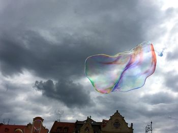 Low angle view of rainbow over building