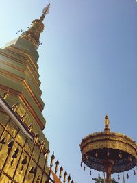 Low angle view of temple against clear blue sky