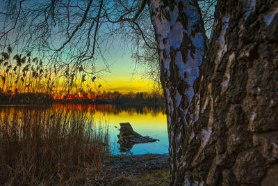 Scenic view of lake against sky during sunset