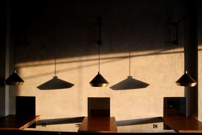 Pendant lights hanging over tables at cafe