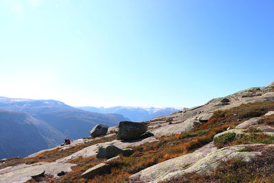 Scenic view of mountains against clear blue sky