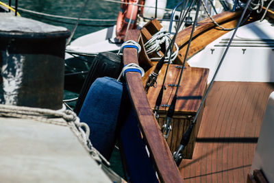 Low section of person sitting on seat in boat